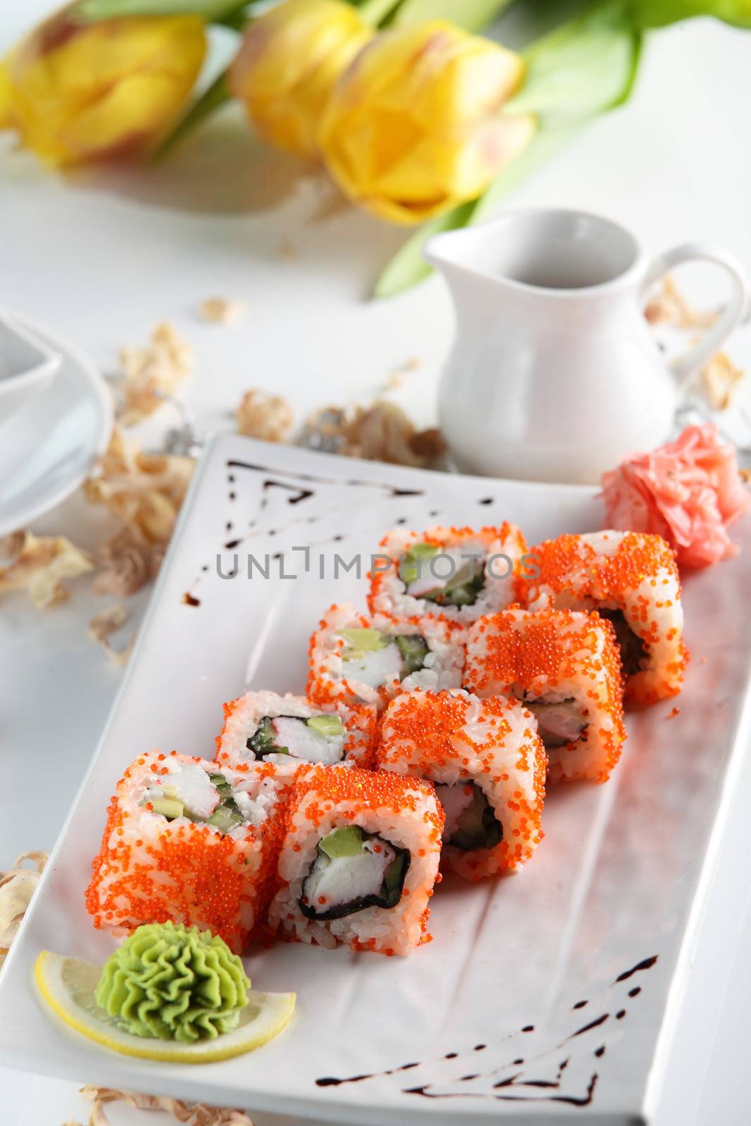 fresh and tasty sushi on bright background