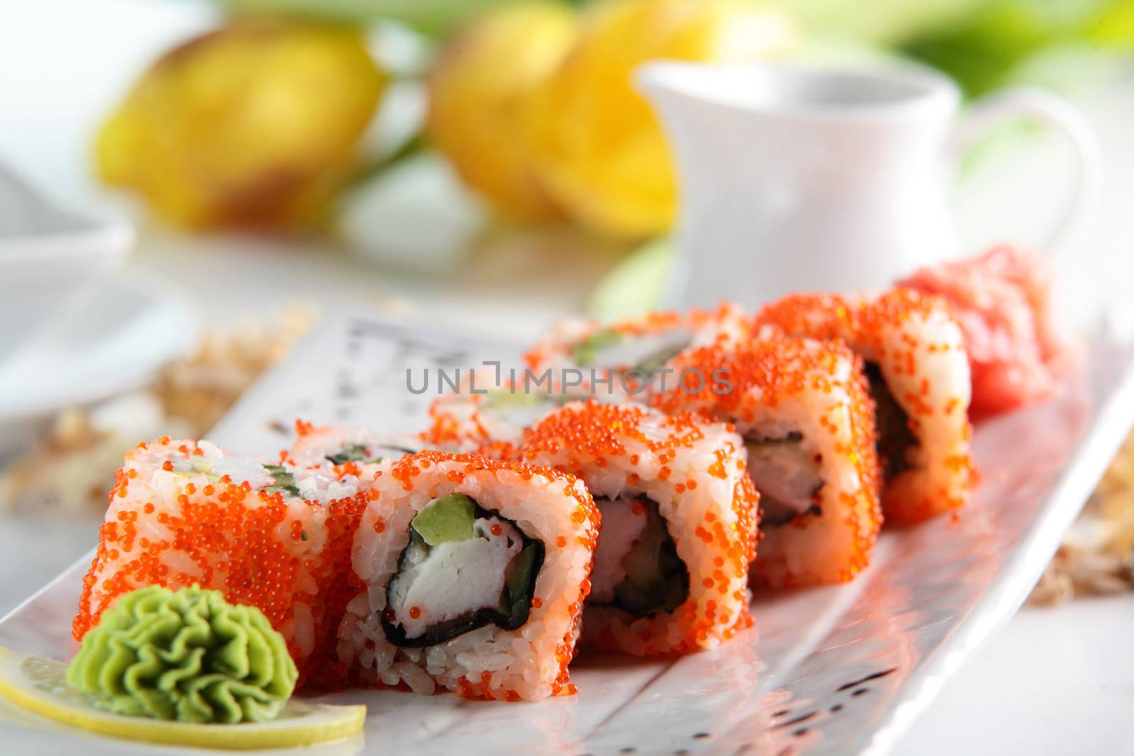 fresh and tasty sushi on bright background