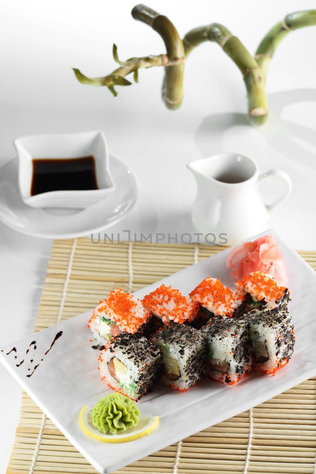 fresh and tasty sushi on bright background