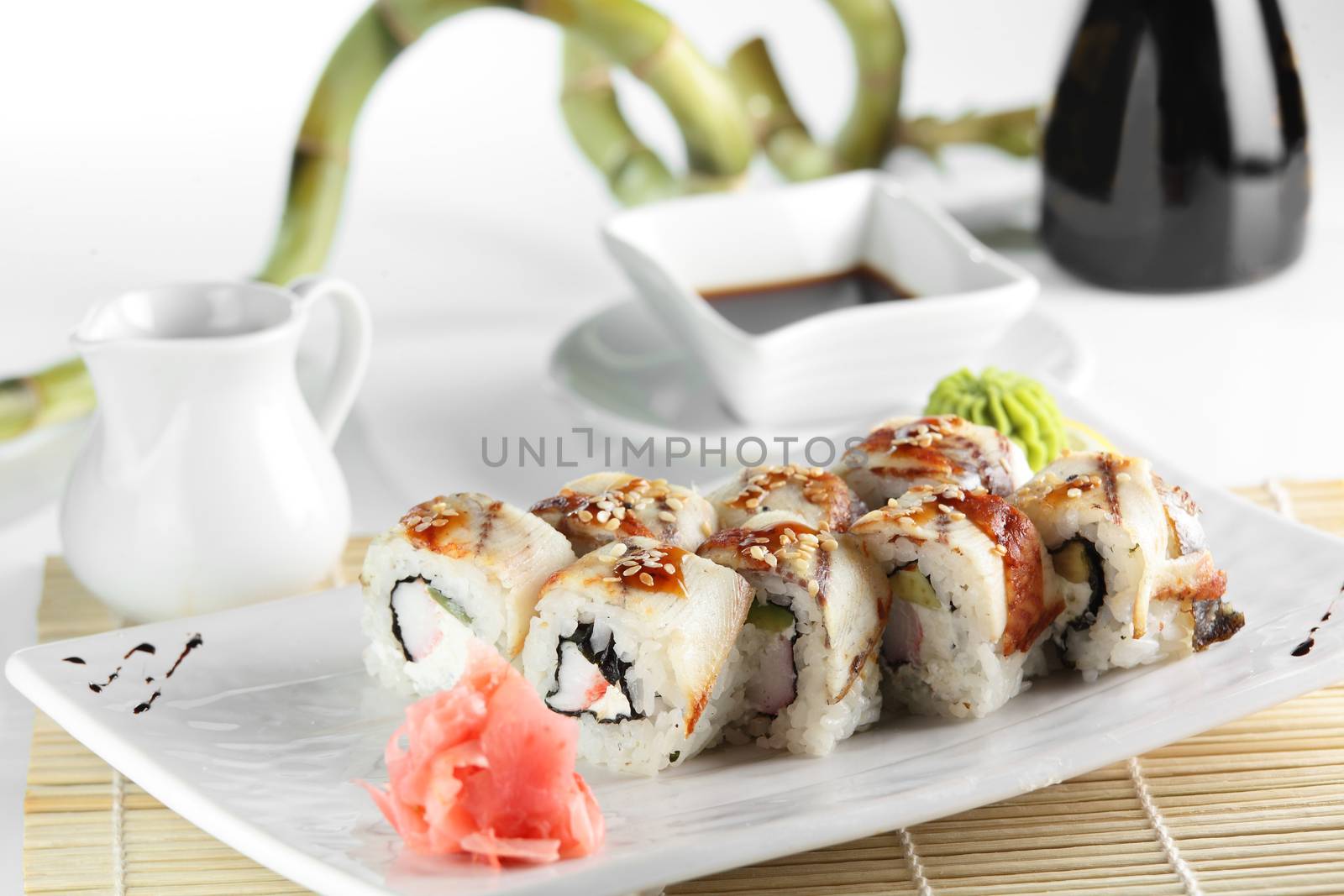 fresh and tasty sushi on bright background