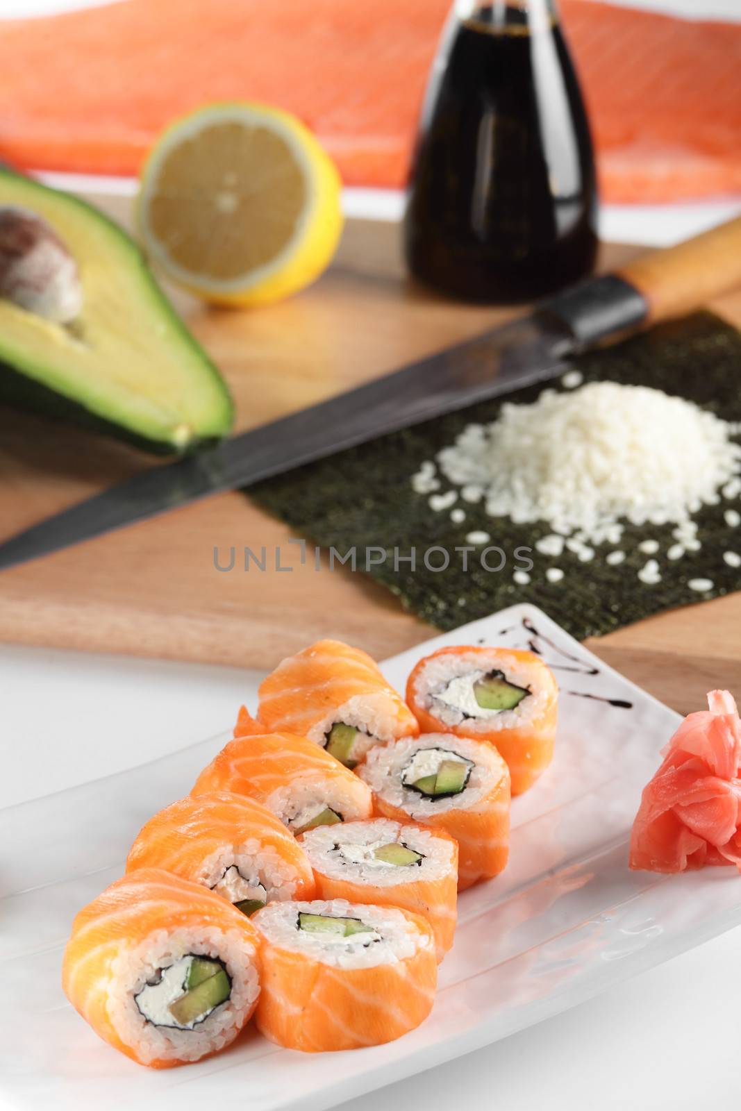 fresh and tasty sushi on bright background