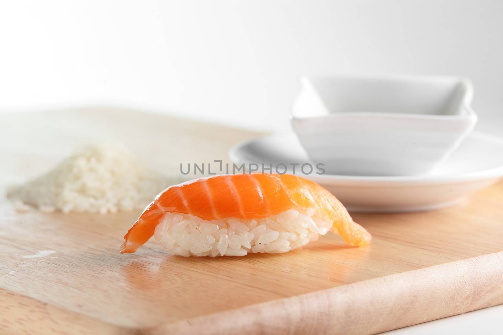 fresh and tasty sushi on bright background