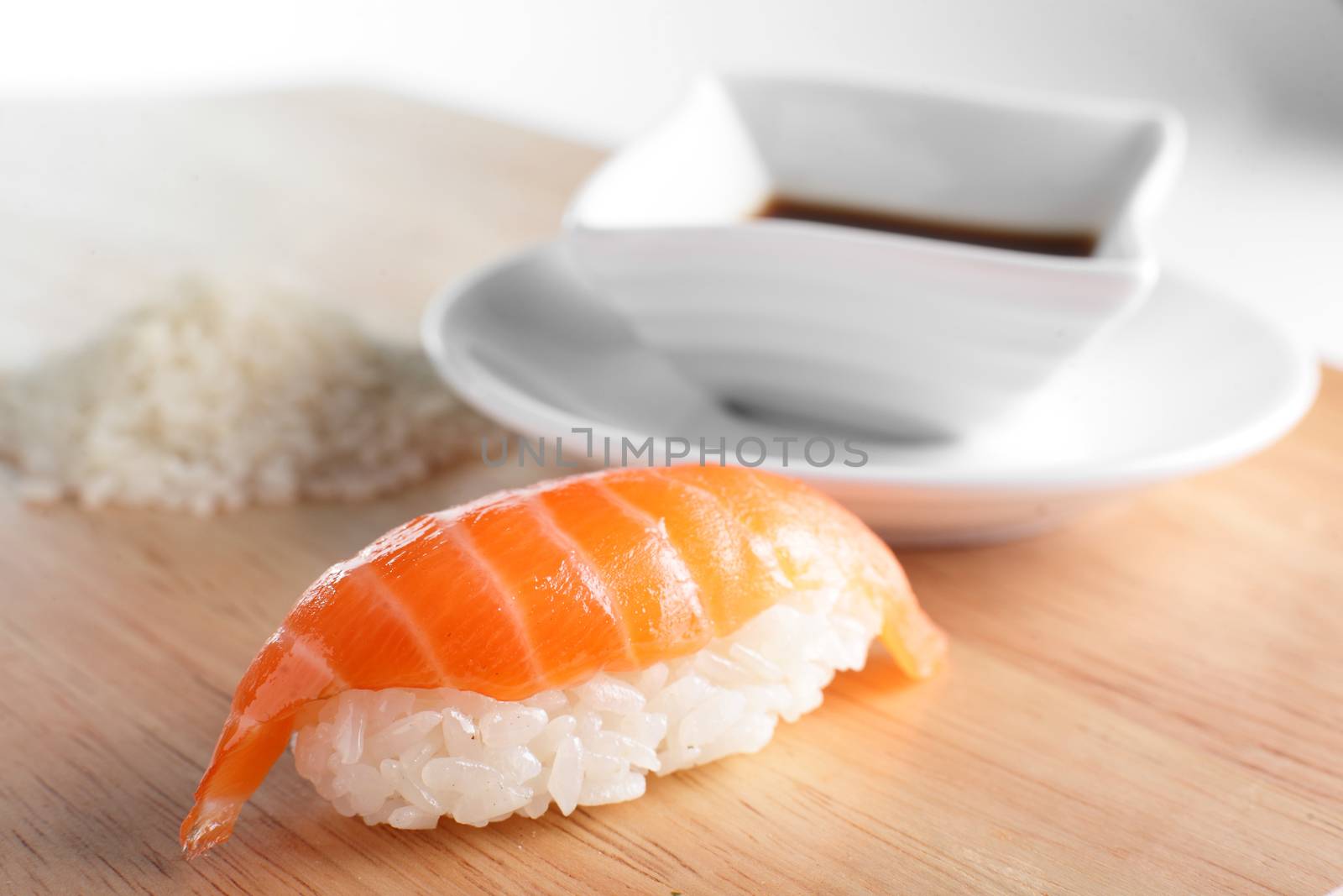 fresh and tasty sushi on bright background