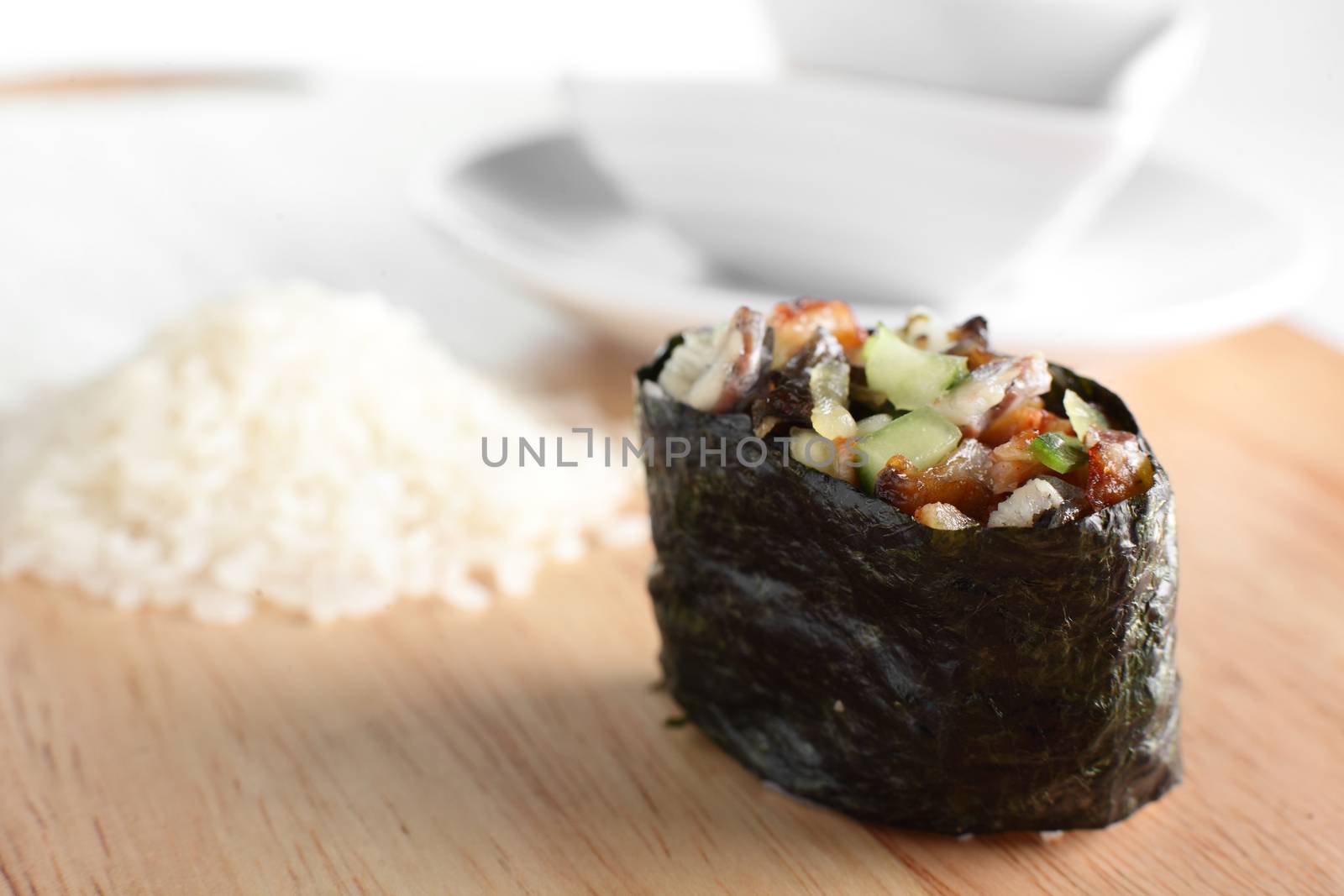 fresh and tasty sushi on bright background