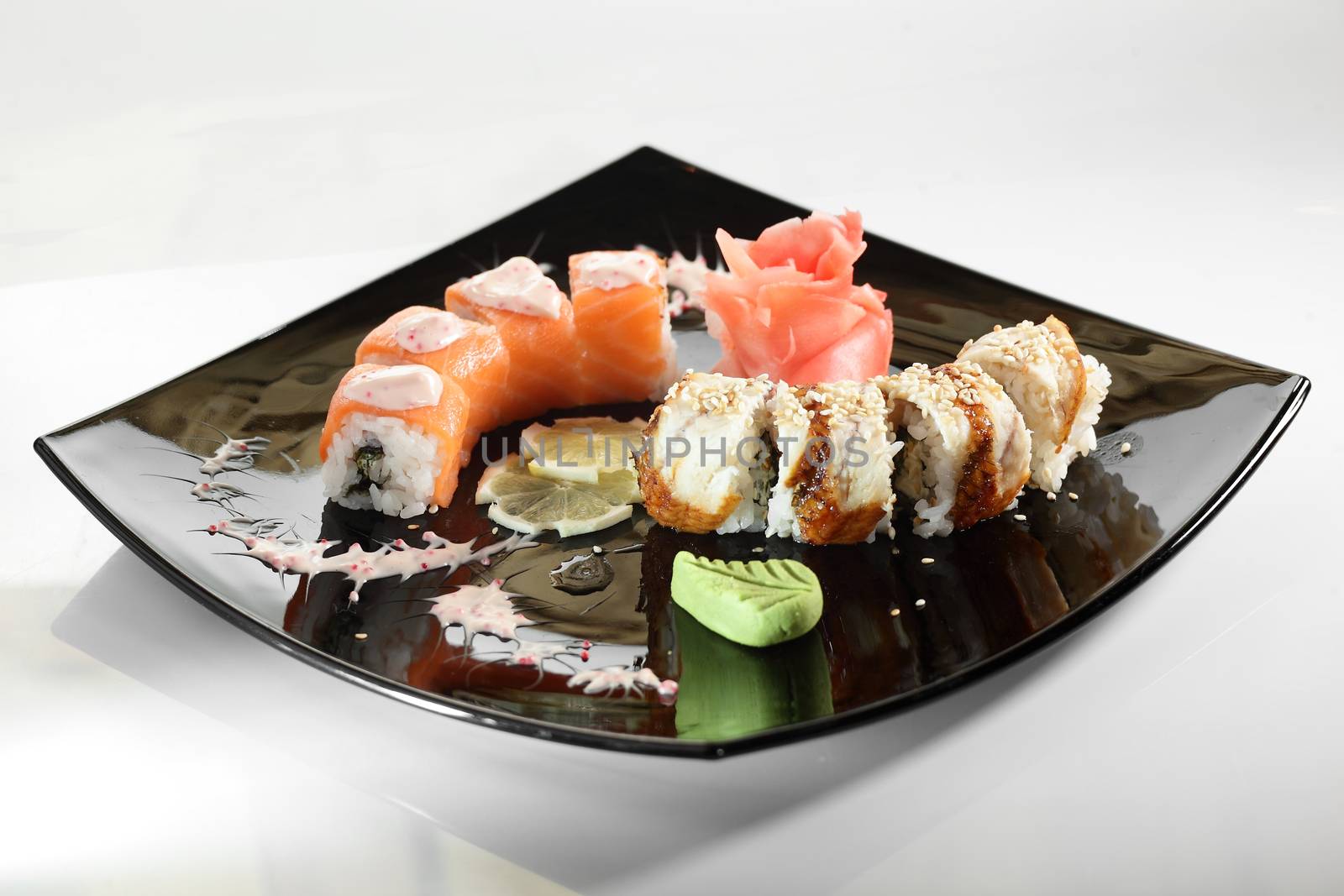 cold sushi on black dish and white background