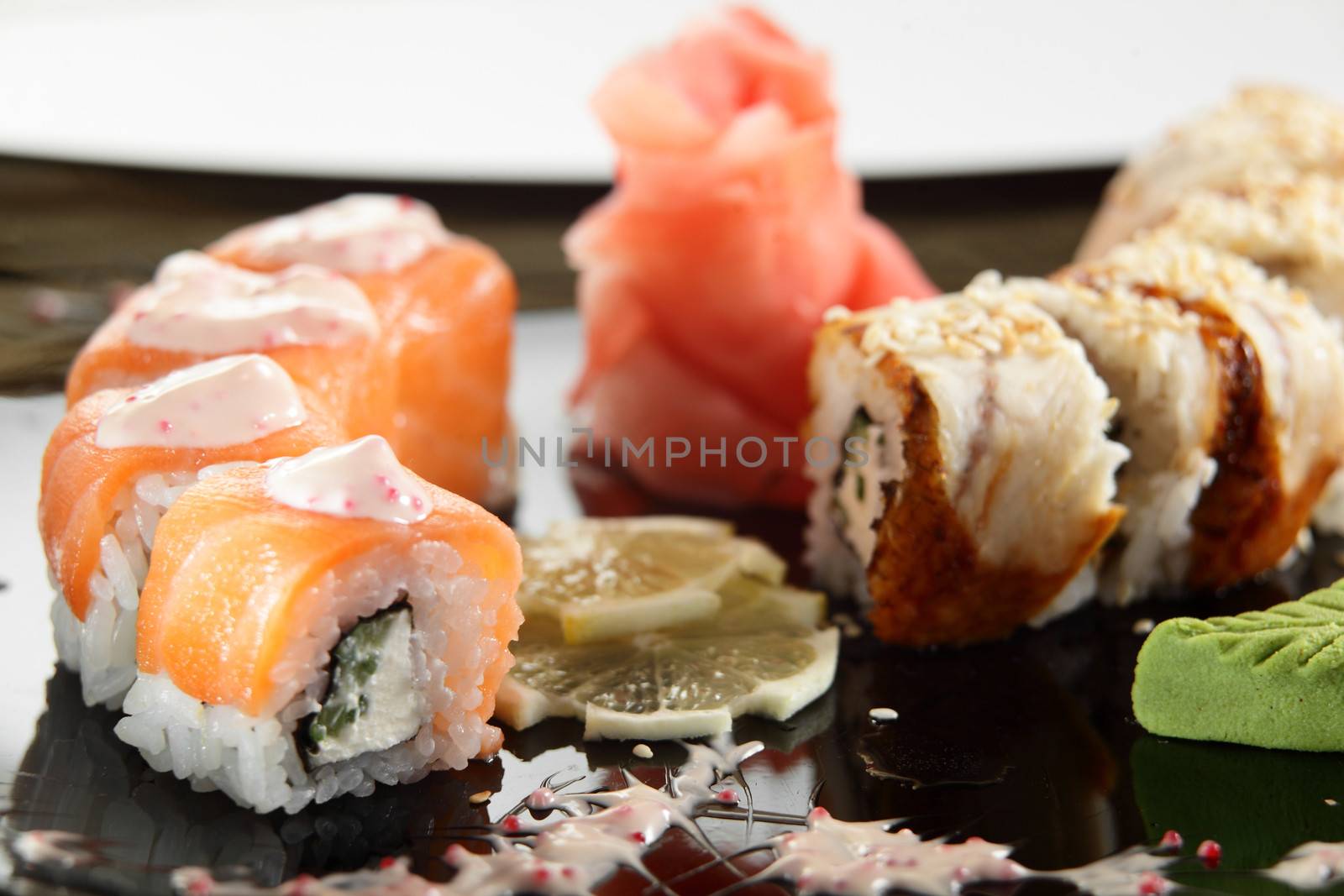 cold sushi on black dish and white background