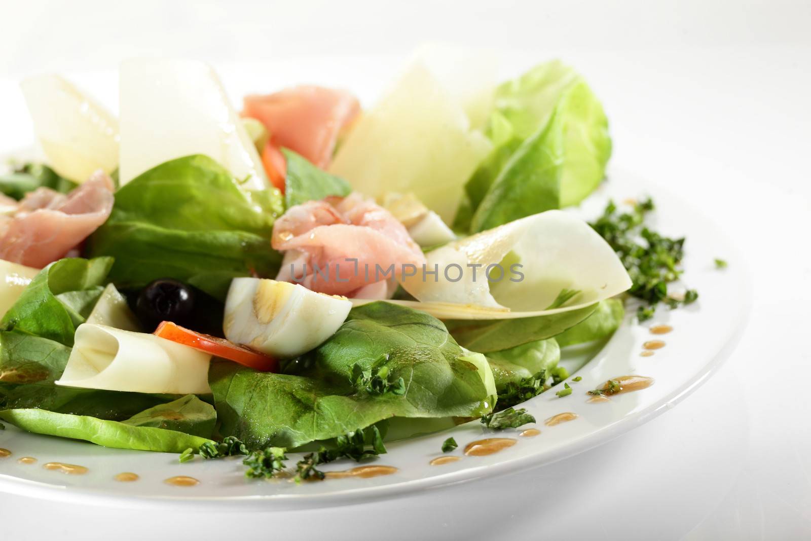 fresh and tasty european salad on white dish