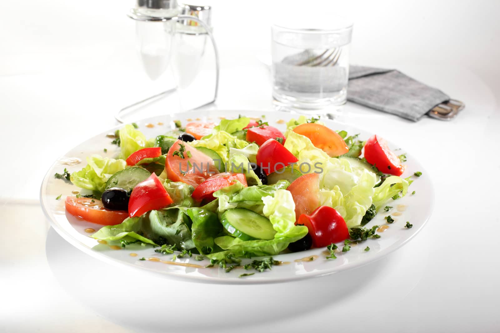 fresh and tasty european salad on white dish