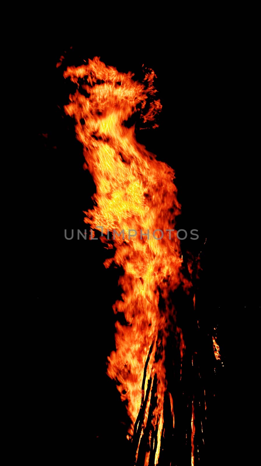 red flames of huge bonfire or campfire as black backgorund