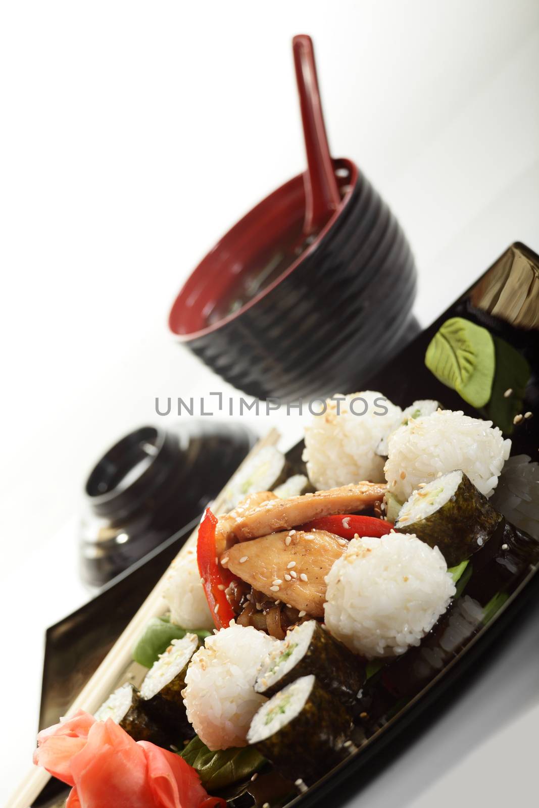 cold sushi on black dish and white background