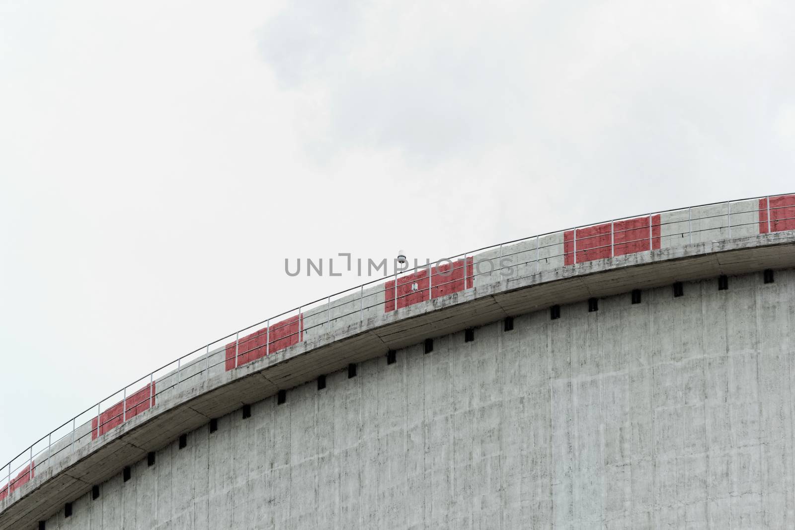 The top of the power plant cooling tower, painted white with red