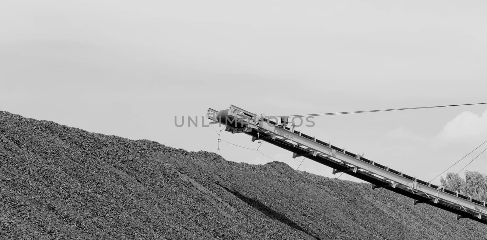 Coal mining in an open pit with huge industrial machine