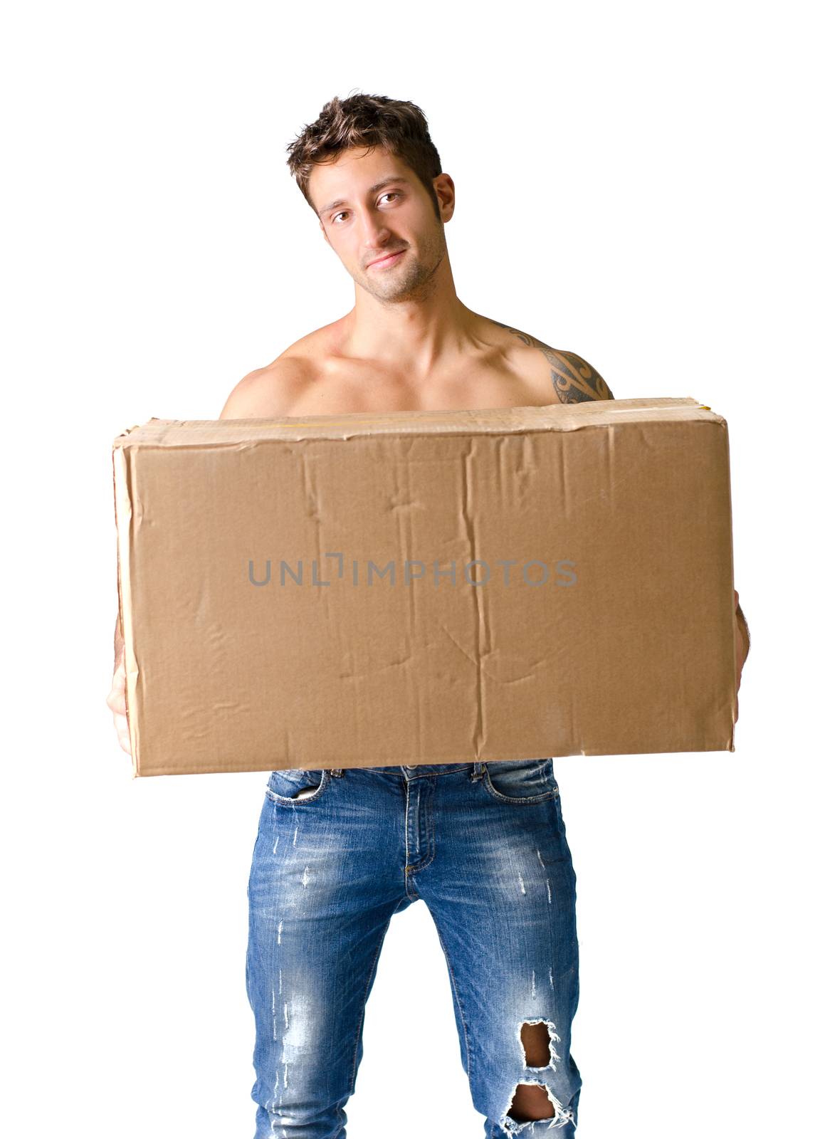 Attractive shirtless young man holding and carrying big cardboard box, isolated on white