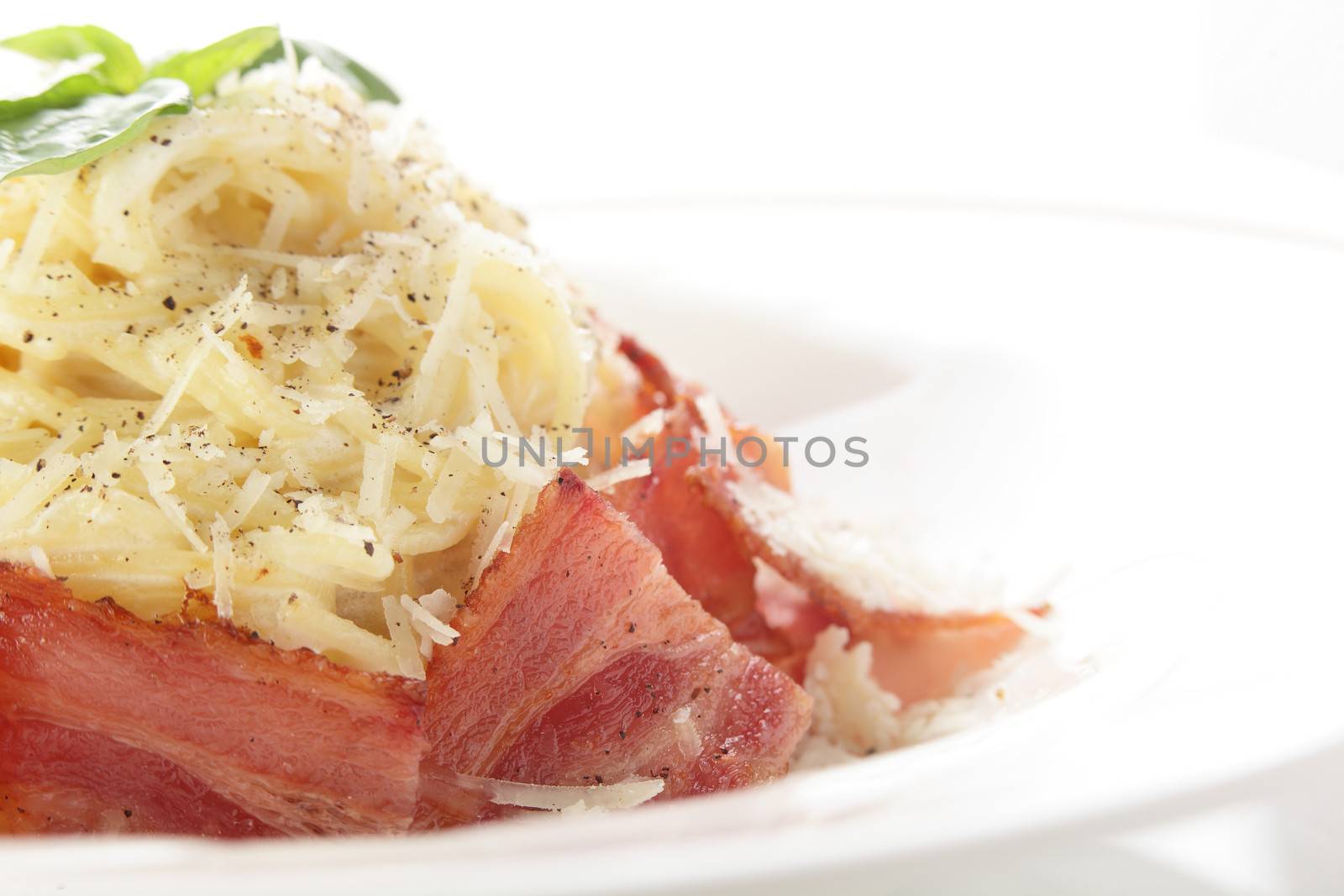 hot and tasty pasta with cheese on white background