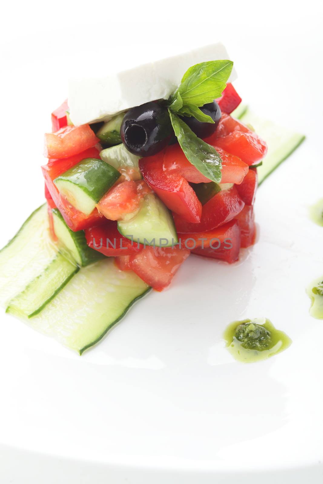 fresh salad with pepper and olives on white background