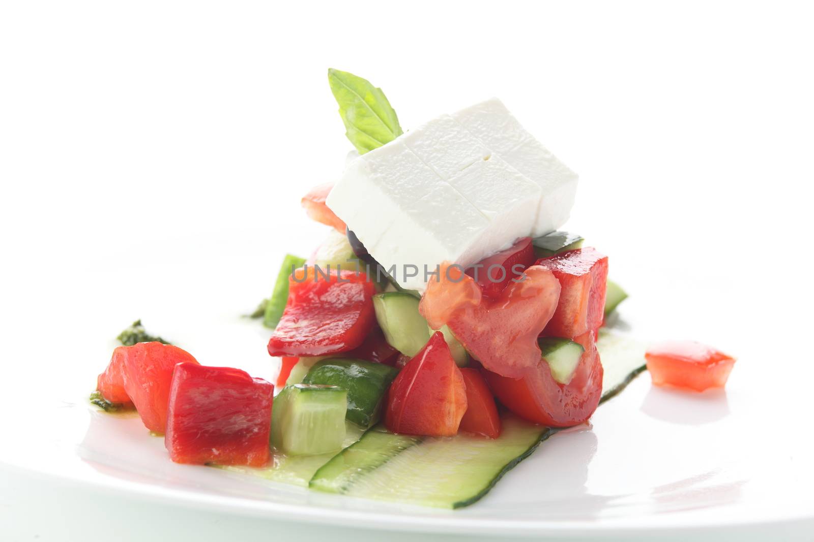 fresh salad with pepper and olives on white background