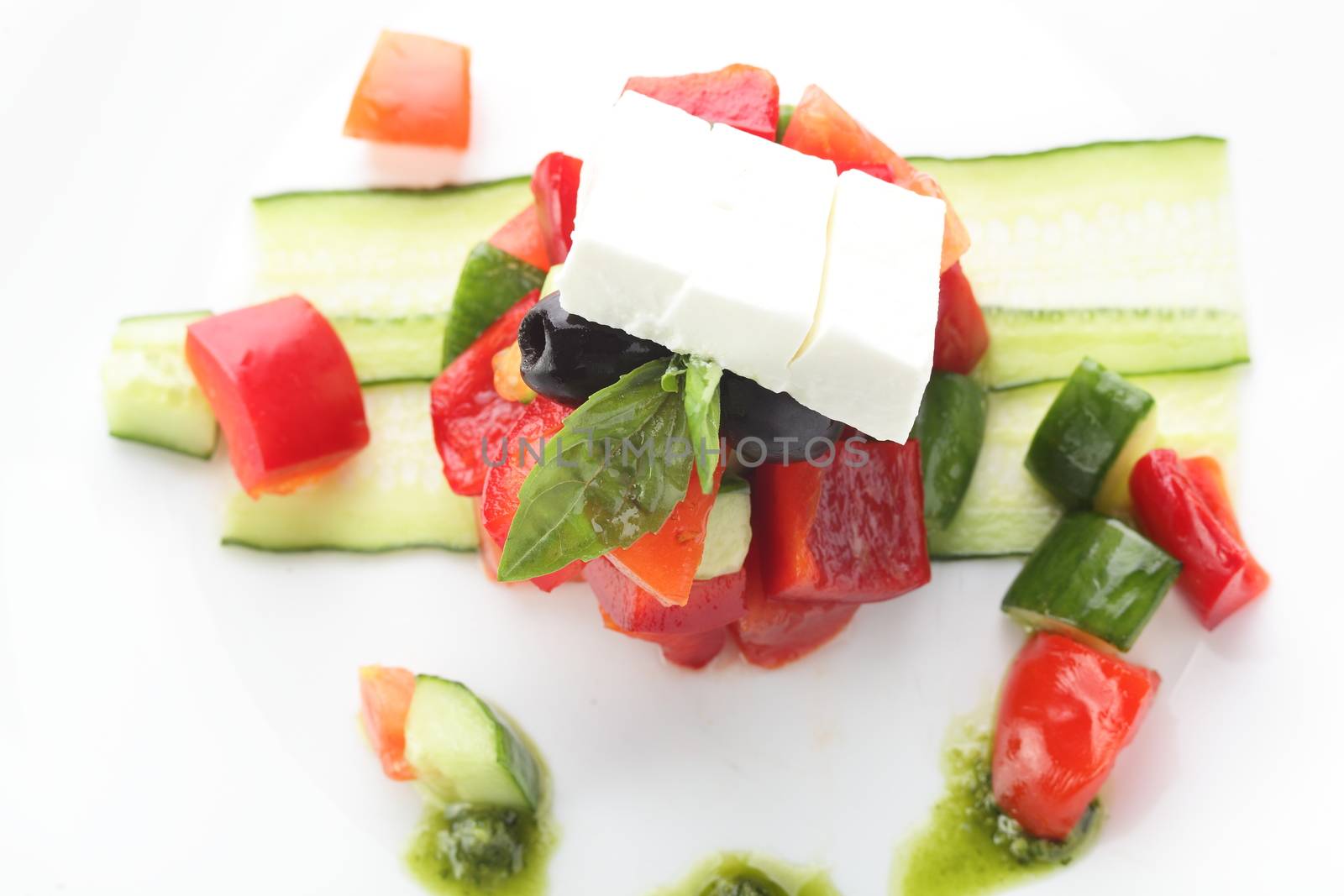 fresh salad with pepper and olives on white background