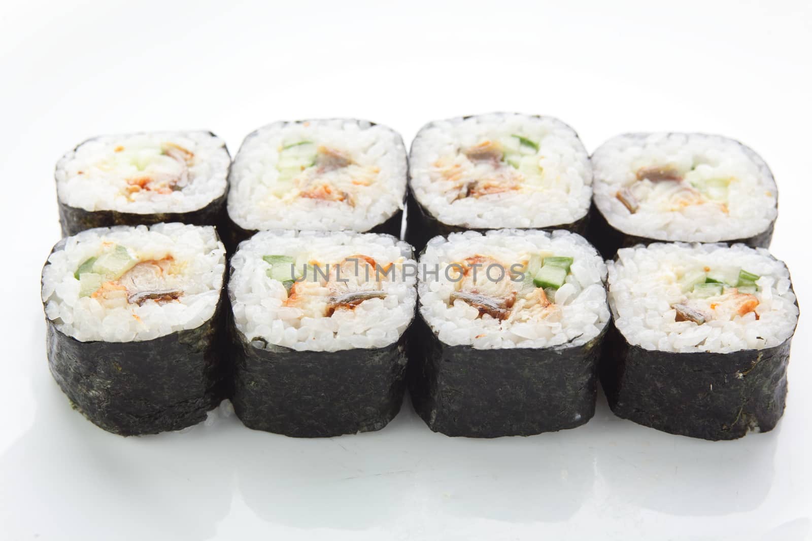 fresh and tasty sushi on white reflective background