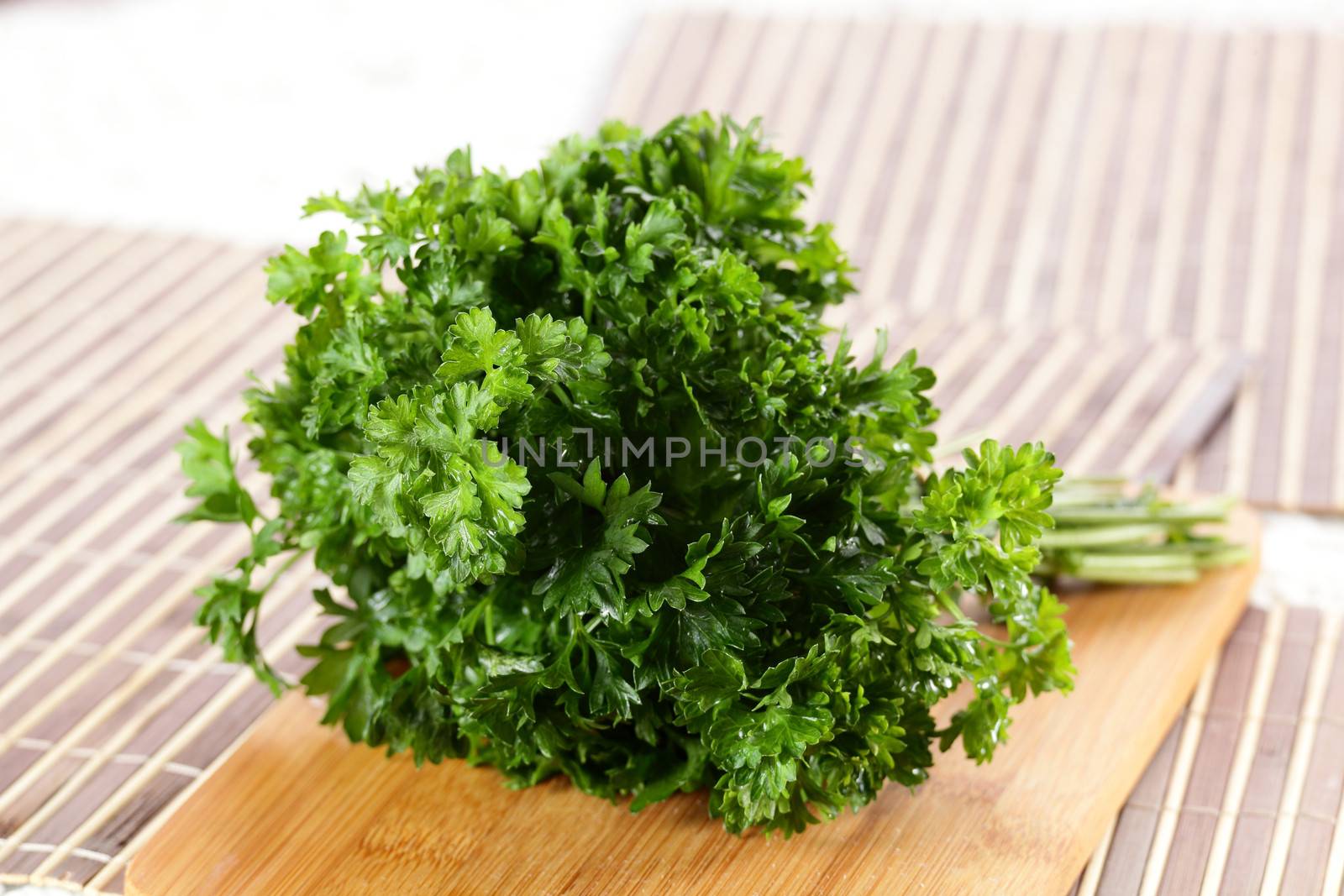 fresh tasty and wet salad on wooden background