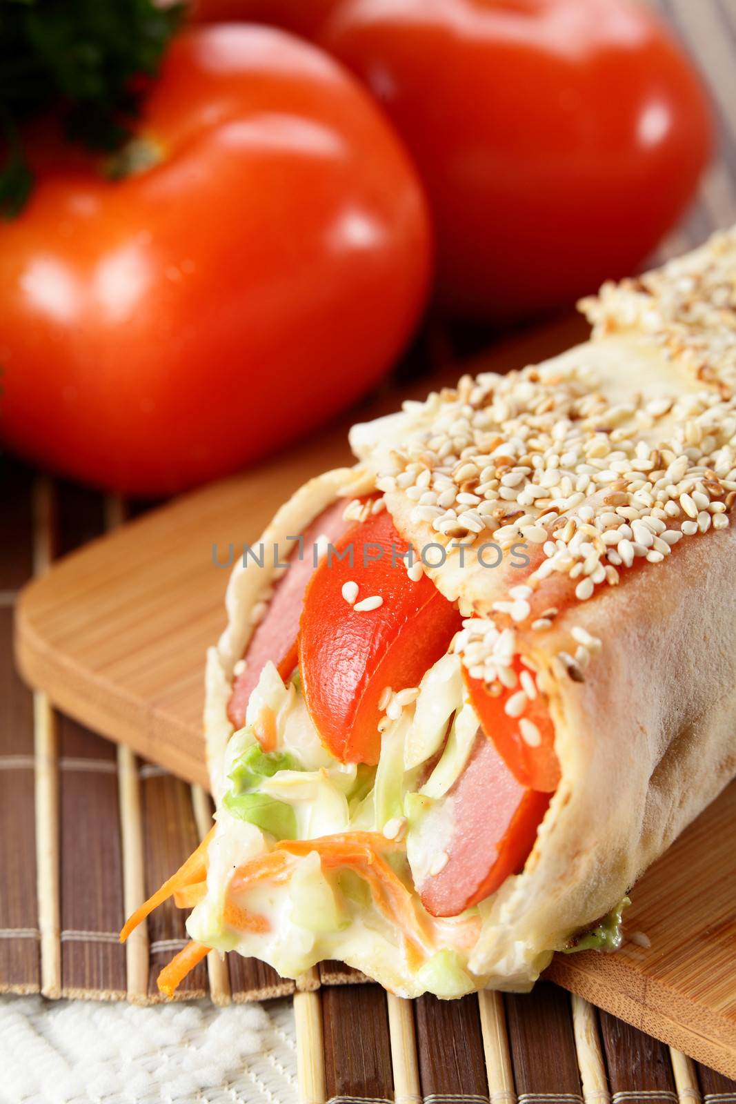 hot fresh and tasty shawarma with vegetables on wooden background