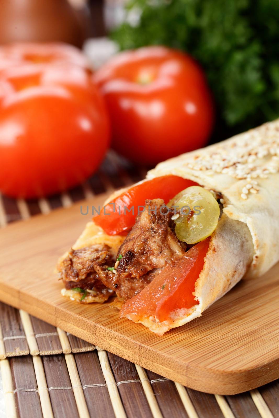 hot fresh and tasty shawarma with vegetables on wooden background