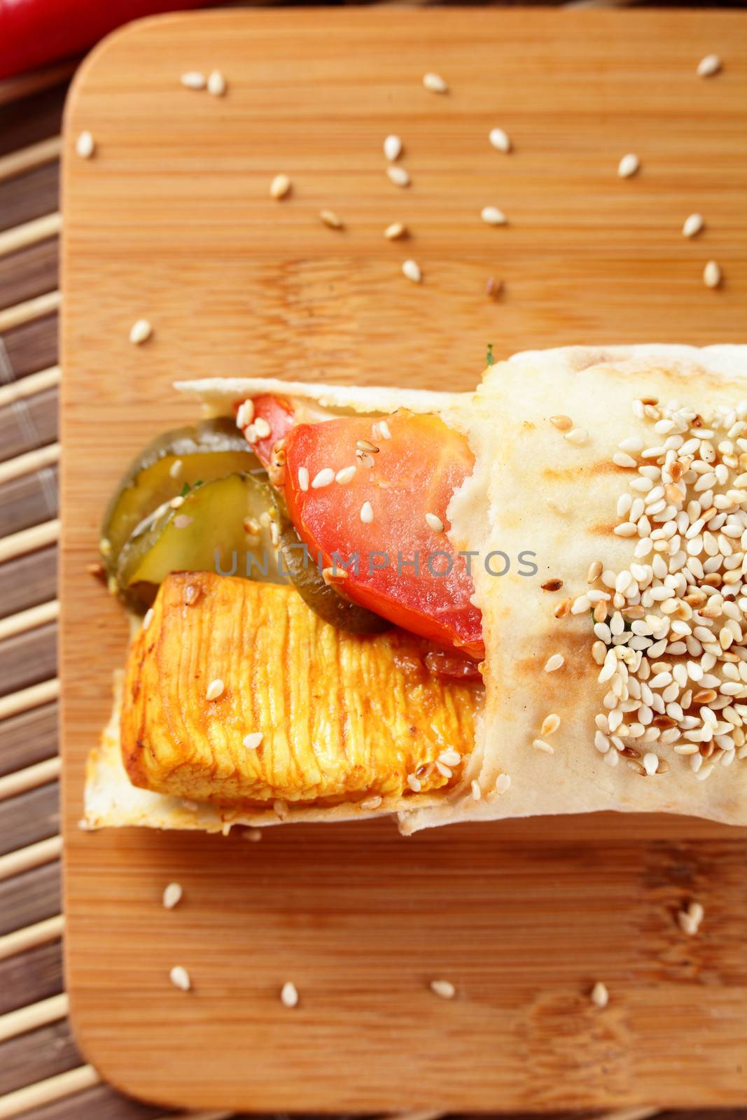 hot fresh and tasty shawarma with vegetables on wooden background