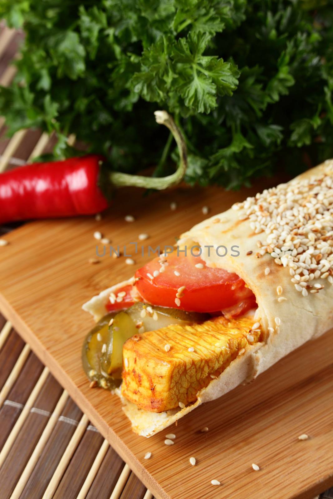 hot fresh and tasty shawarma with vegetables on wooden background