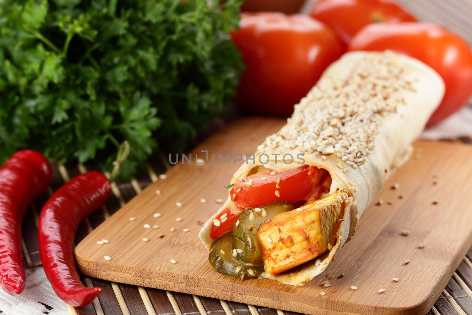 hot fresh and tasty shawarma with vegetables on wooden background