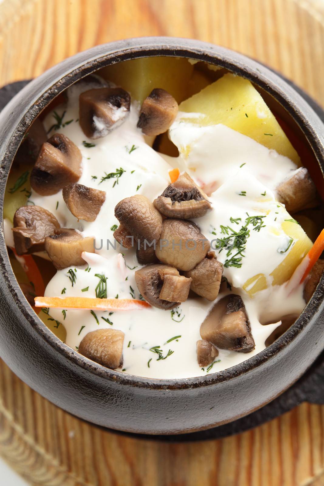 hot roasted meat with pancake and mushrooms on wooden desk