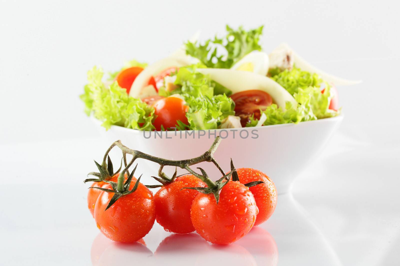 fresh and tasty salad on white background