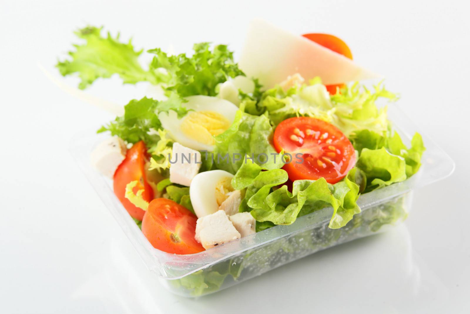 fresh summer salad on white background by fiphoto