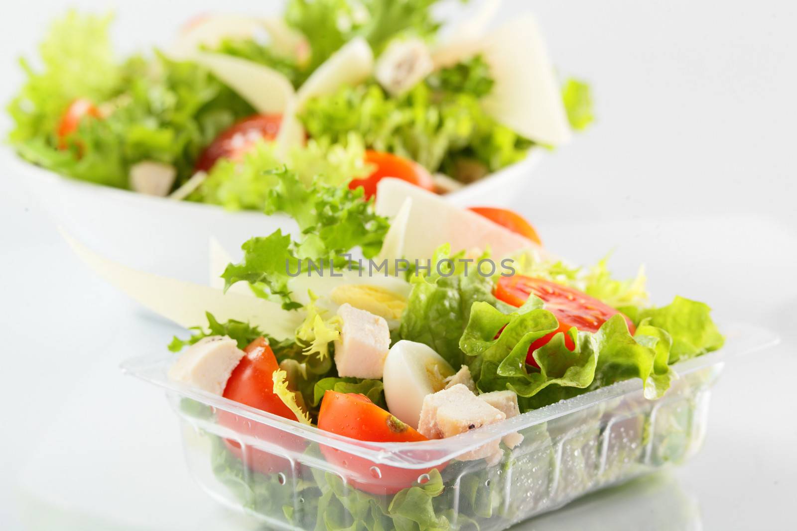 fresh summer salad on white background by fiphoto