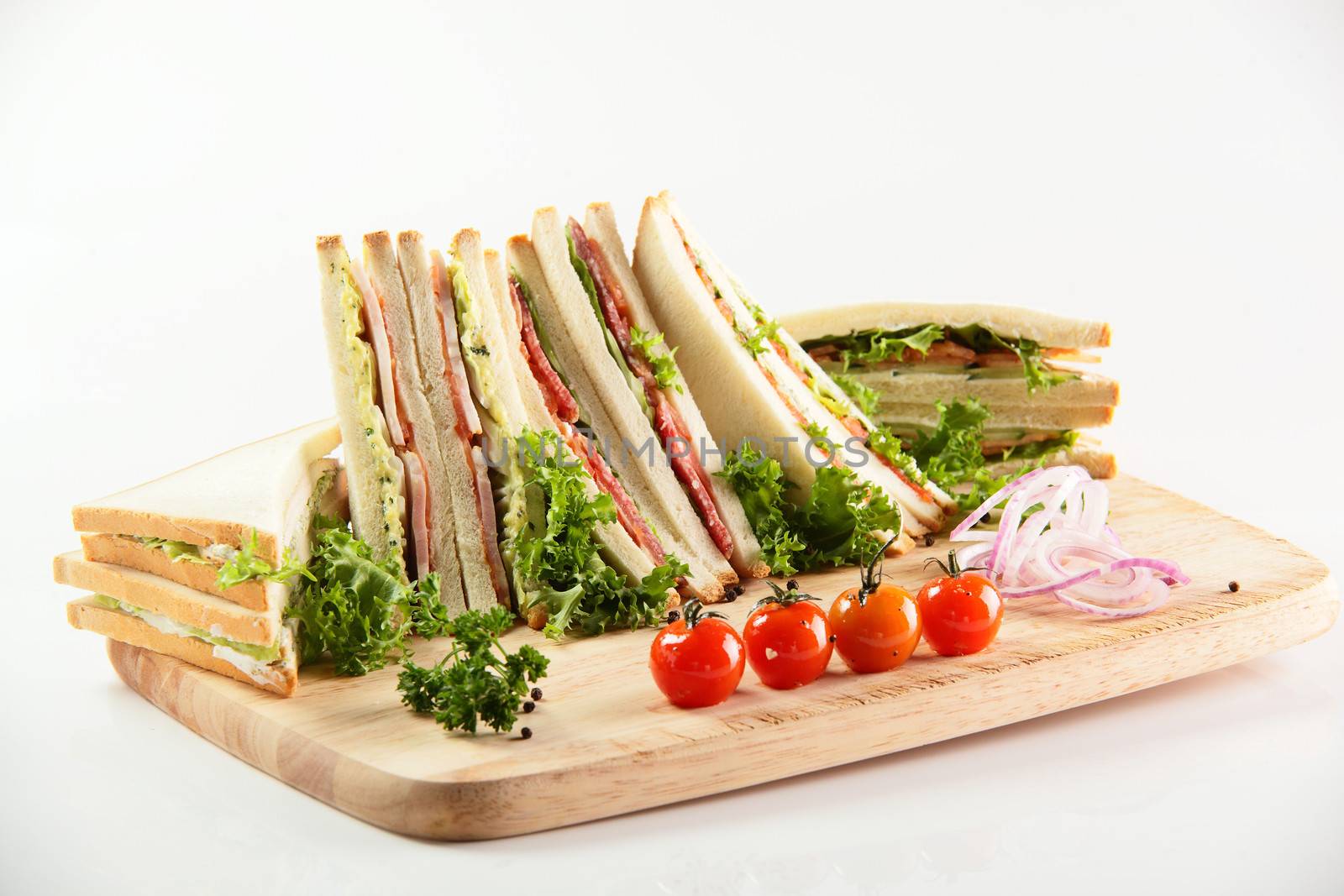 fresh sandwiches on wooden desk and white background