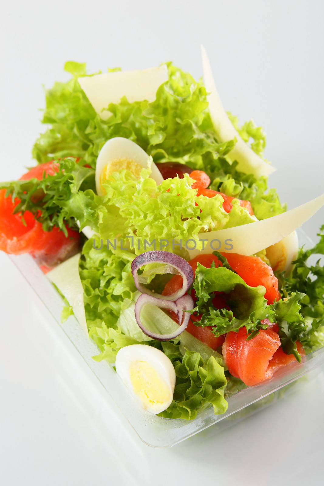fresh and tasty salad on white background