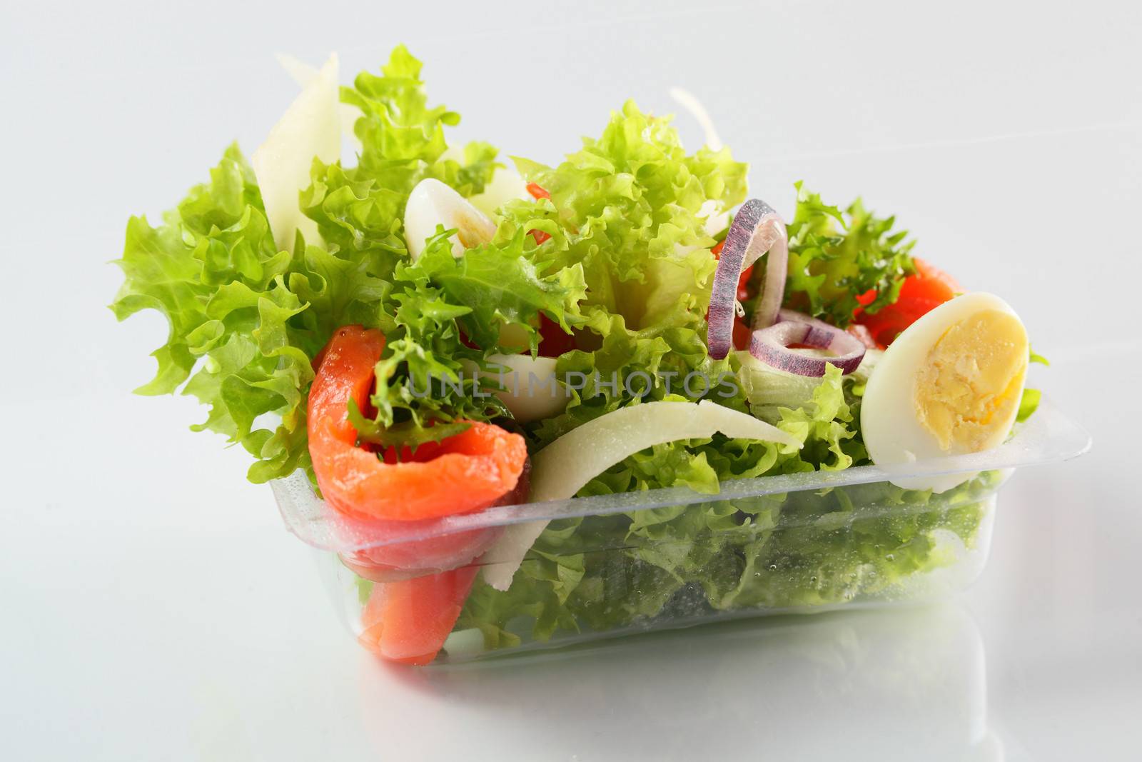 fresh summer salad on white background by fiphoto