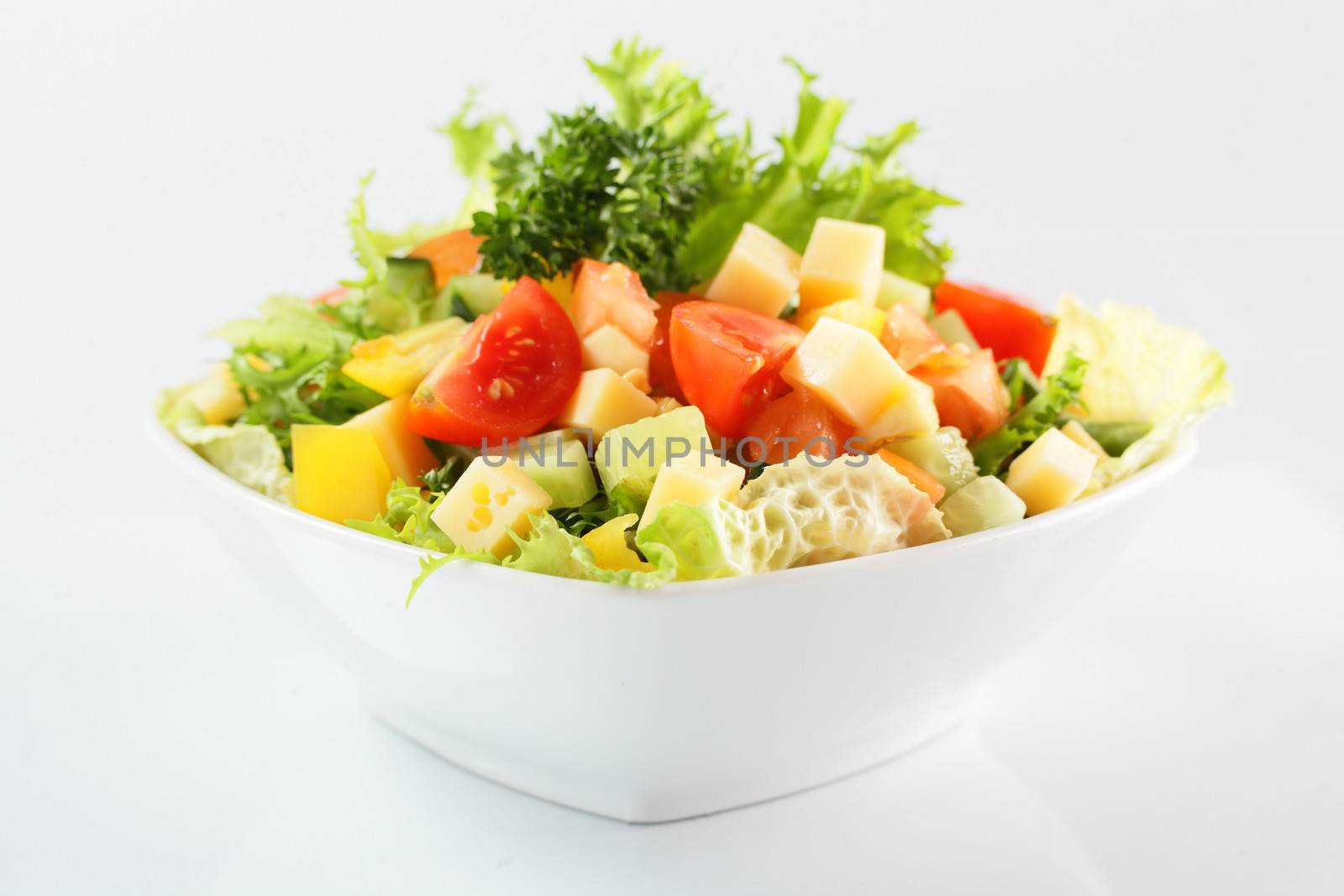 fresh and tasty salad on white background