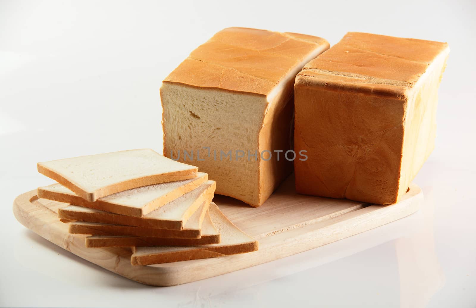 tasty bread on white background by fiphoto