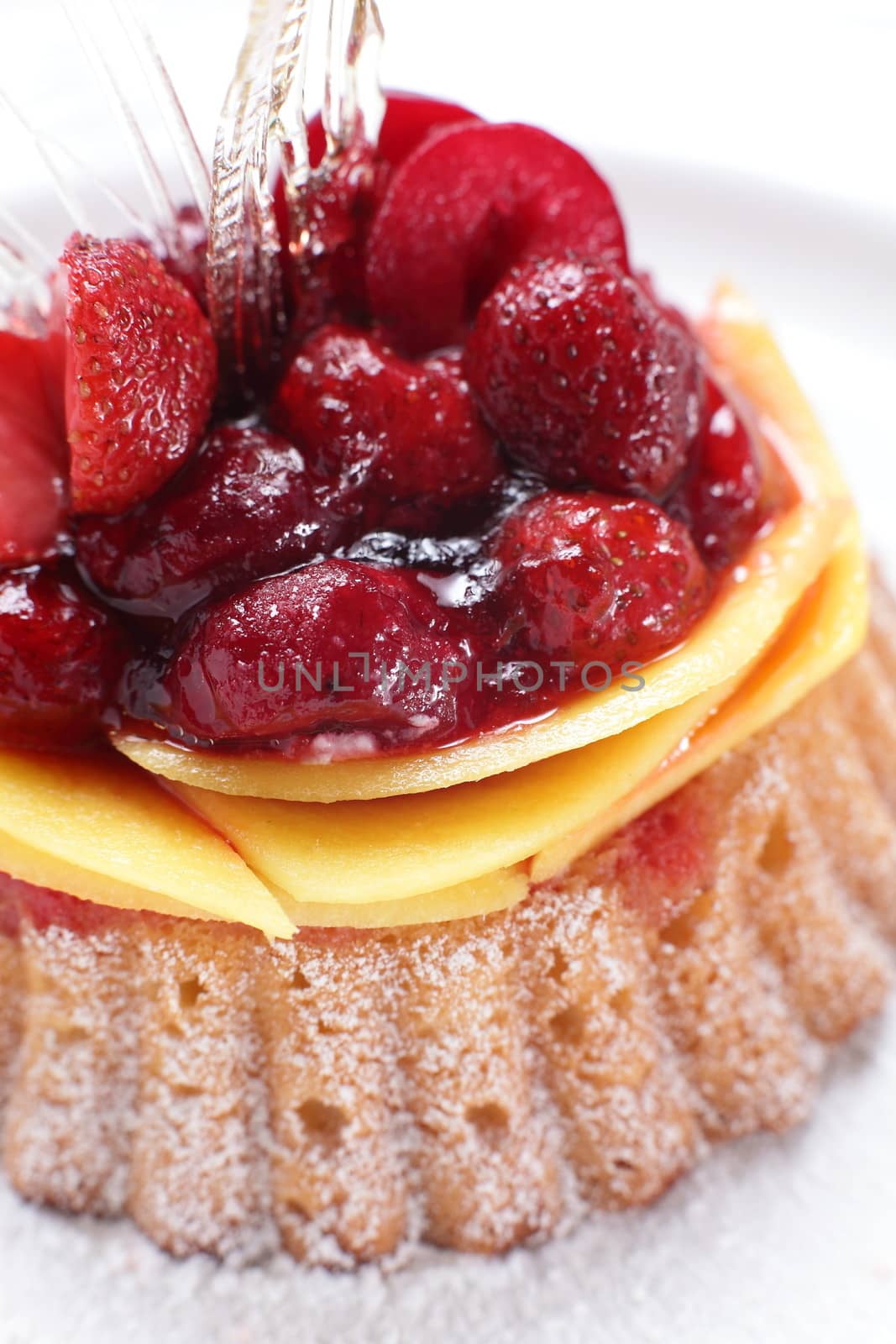 tasty and sweet cake on dish and white background