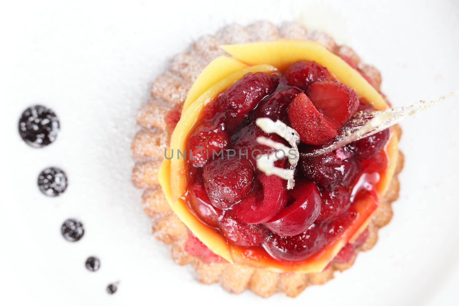 tasty and sweet cake on dish and white background