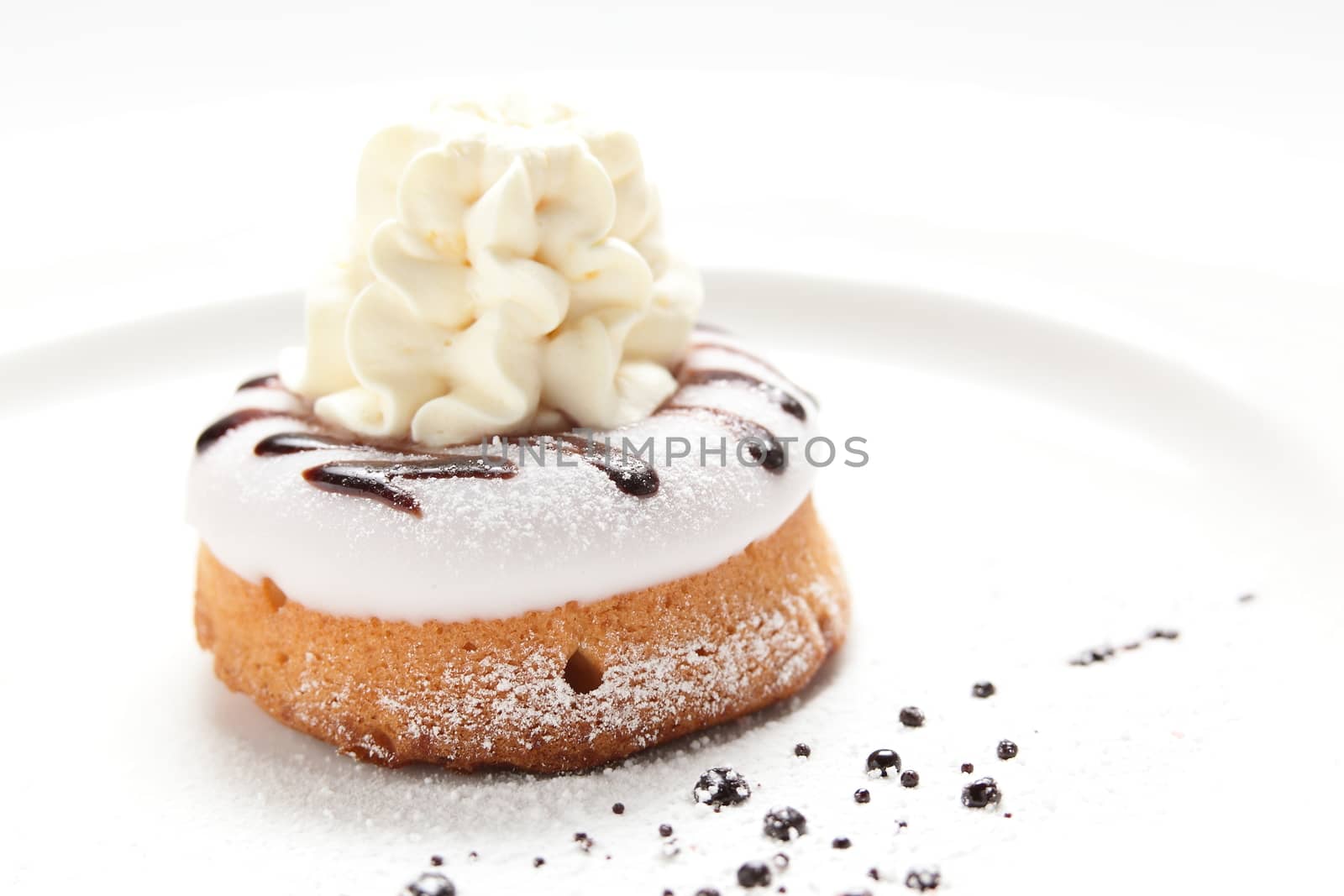 fresh and sweet cake on dish by fiphoto