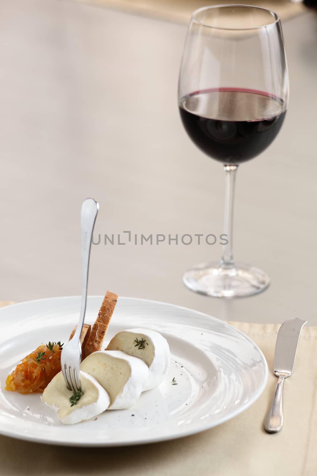 peaces of cheese on white dish by fiphoto