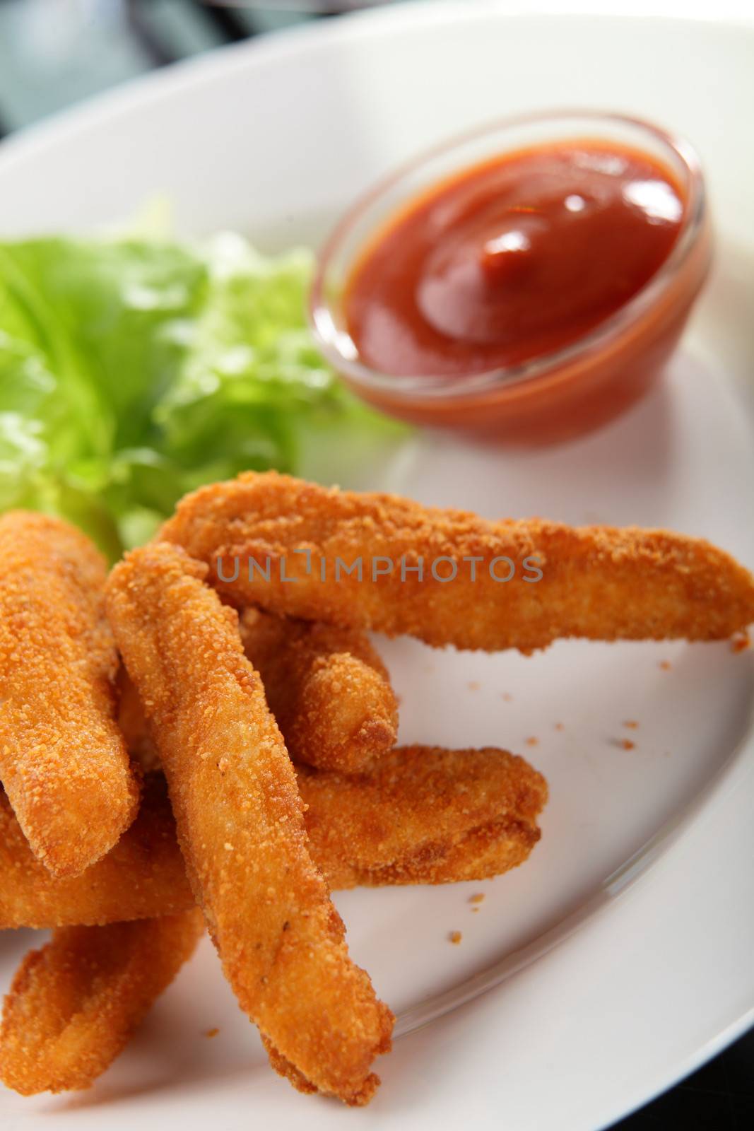 roasted potato sticks with garnish by fiphoto