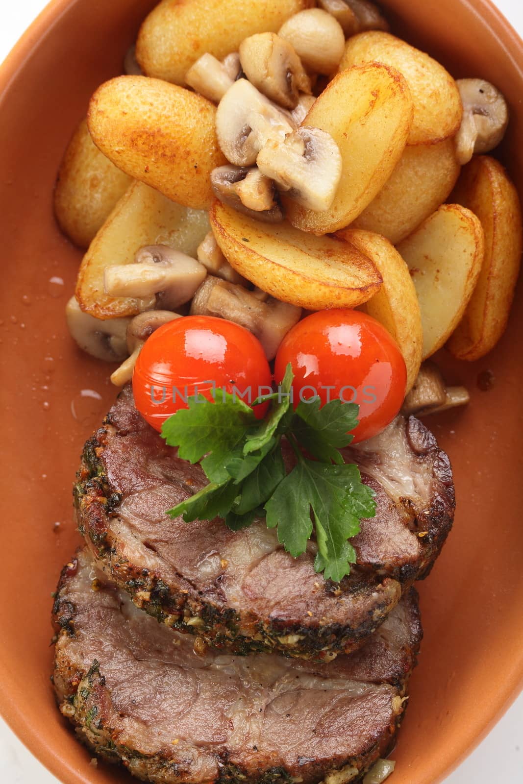 peaces of meat with garnish by fiphoto