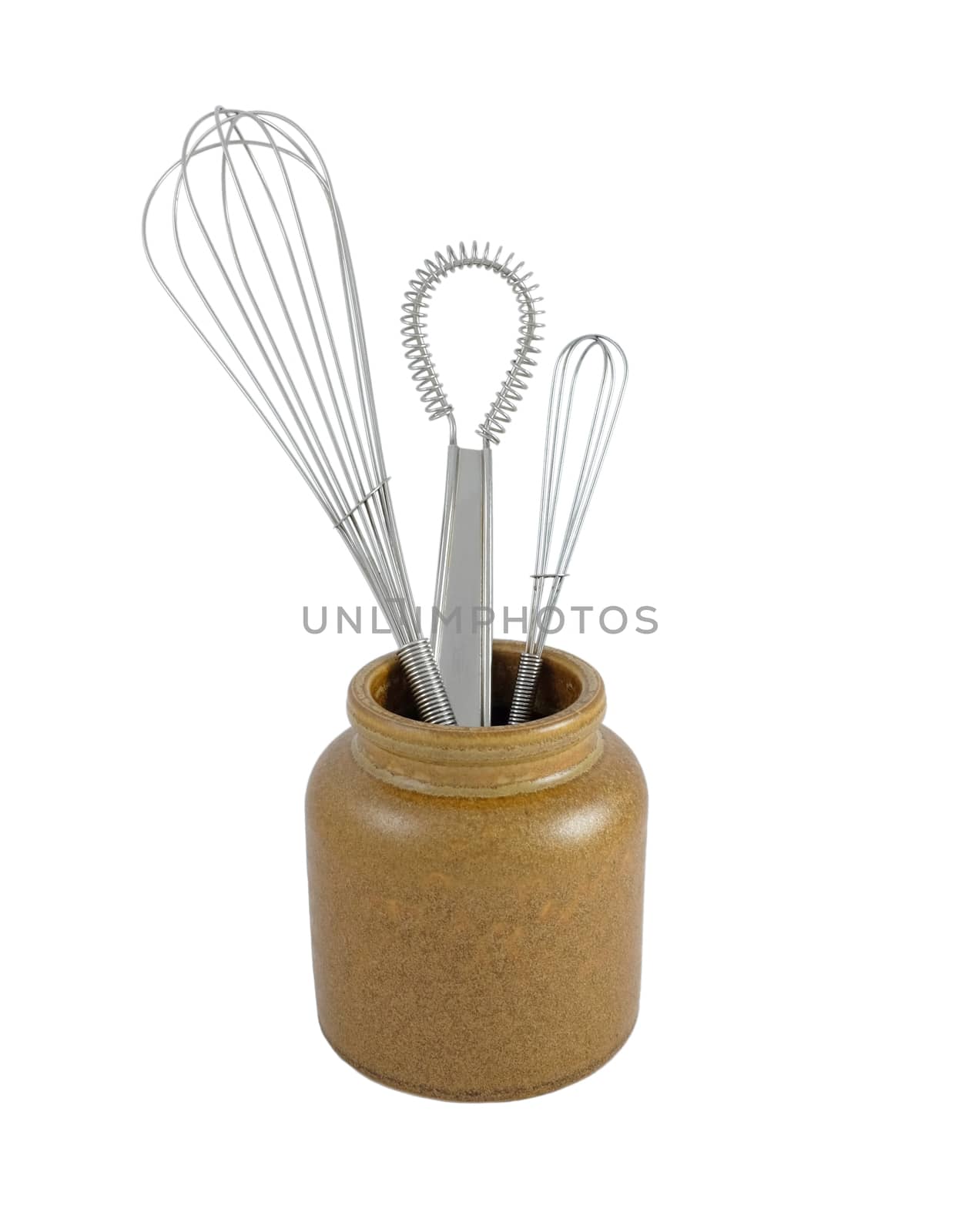 Three metal whisks in a brown ceramic jar, isolated on a white background 