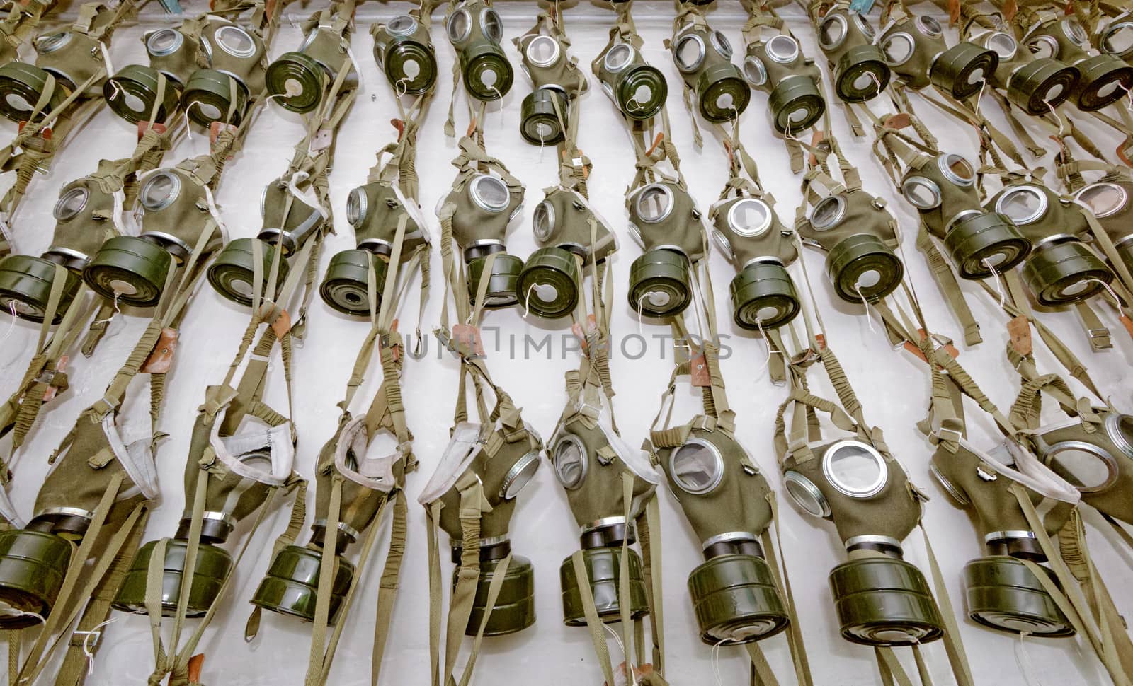 old military gas masks hanging on each other
