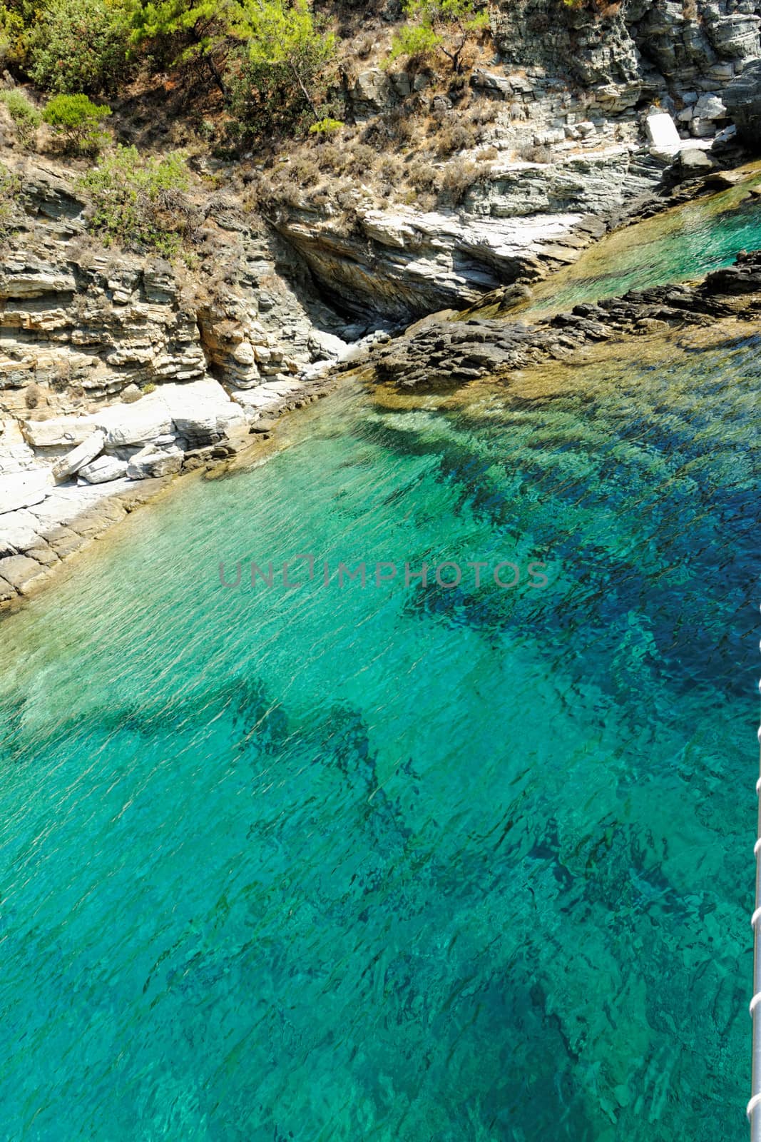 rocky beach with turquoise sea in greece thassos island