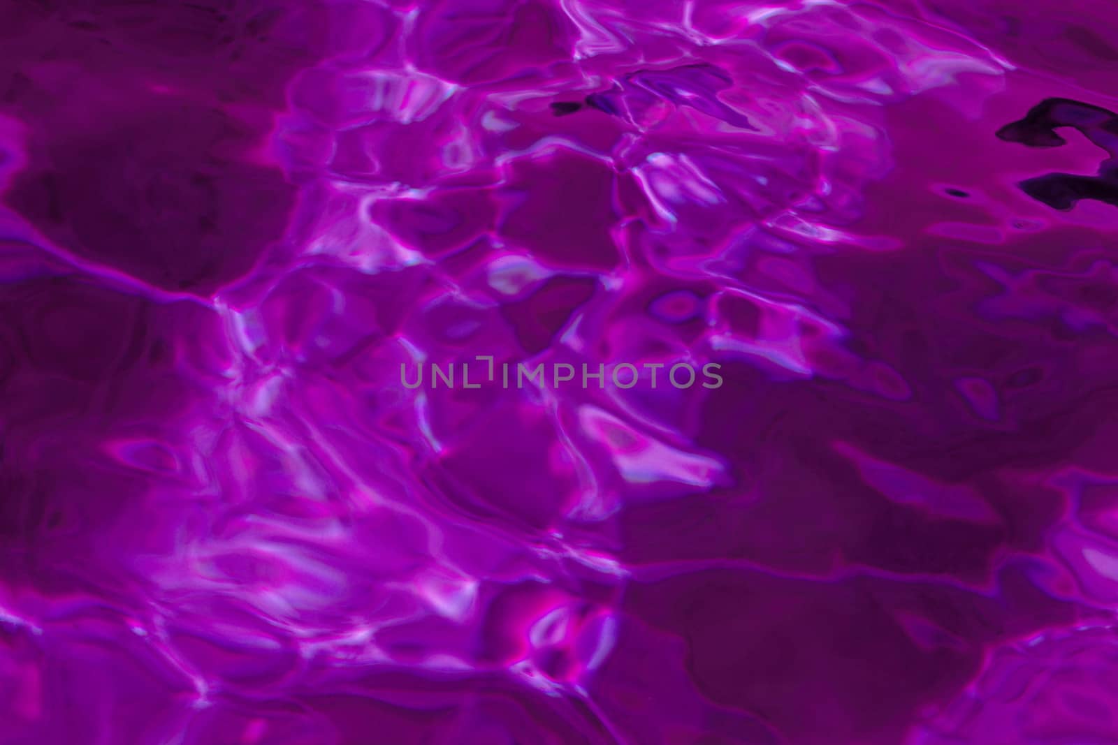 purple abstract background of wavy water surface (lilac)