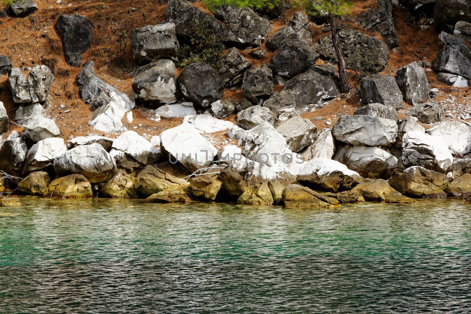 rocky beach with turquoise sea in greece thassos island