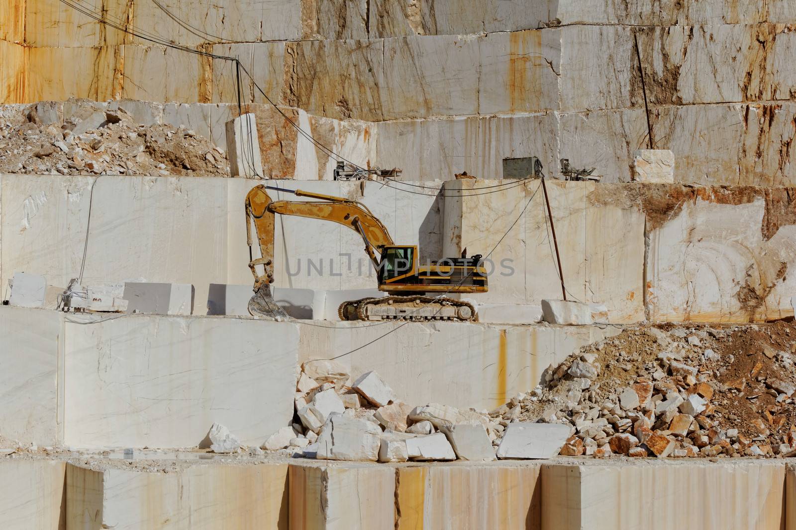Detail of huge Thassos white marble quarry (mine) with grabber