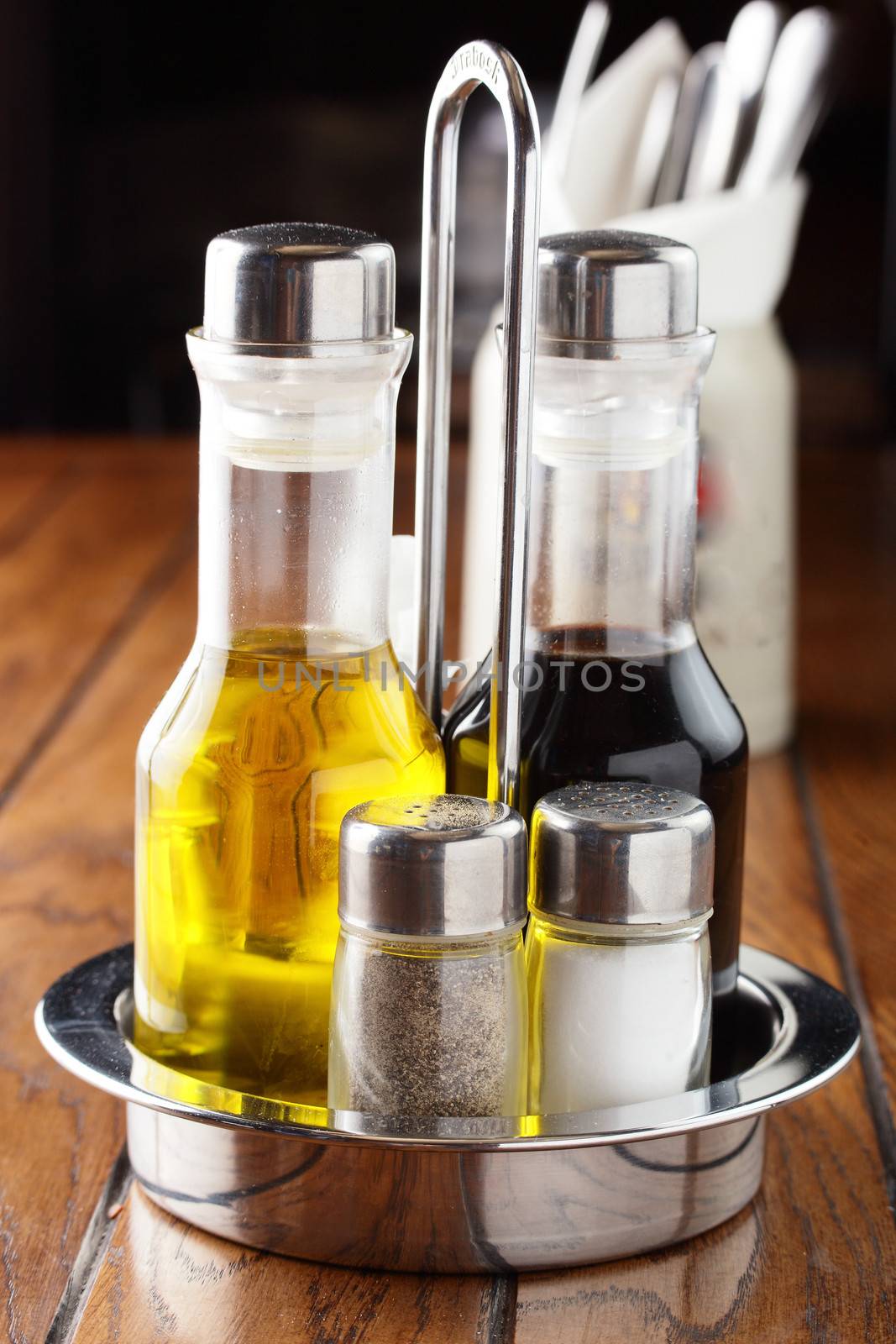 bottles with oil and salt and pepper by fiphoto